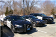 A row of three different police cruisers